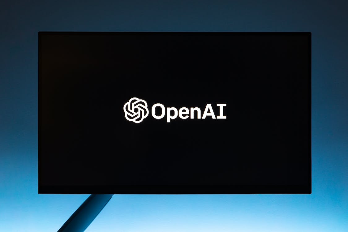 Free Monitor screen with OpenAI logo on black background Stock Photo